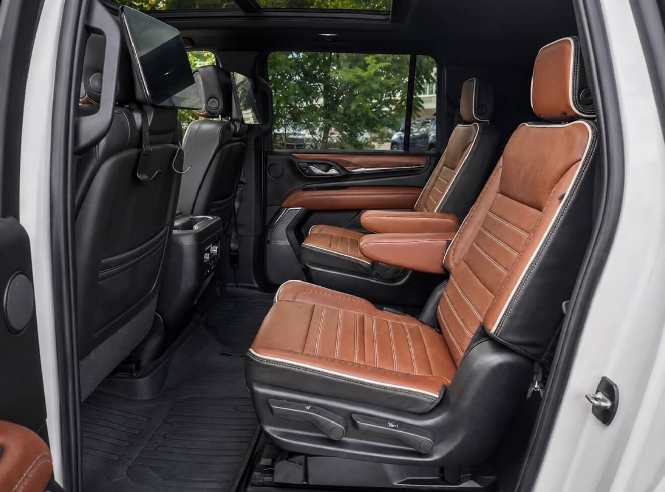 GMC Yukon Denali XL Ultimate brown leather second-row captain's chairs